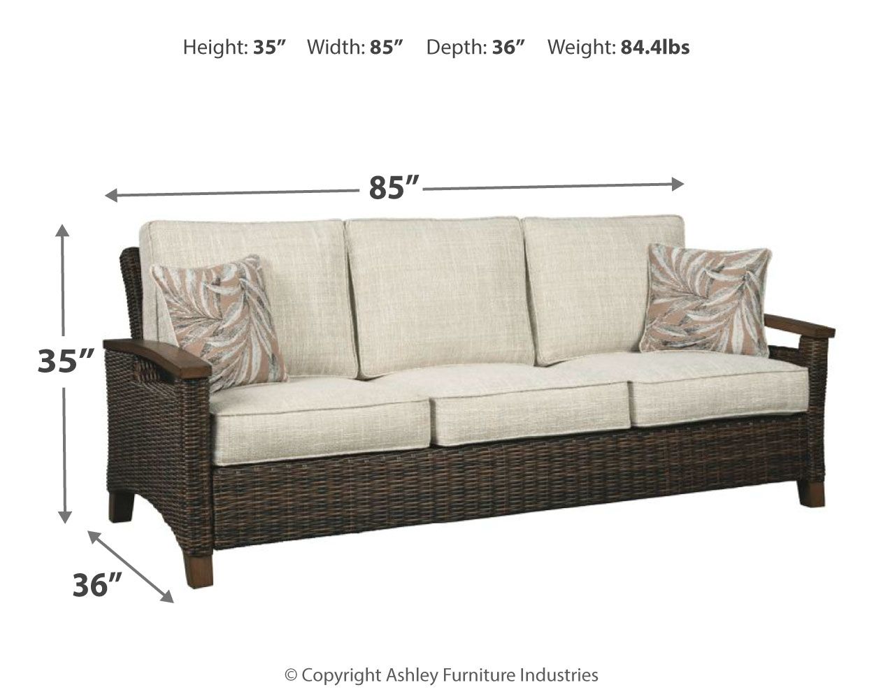 Medium brown wicker sofa with beige cushions and two patterned throw pillows, 85 in width