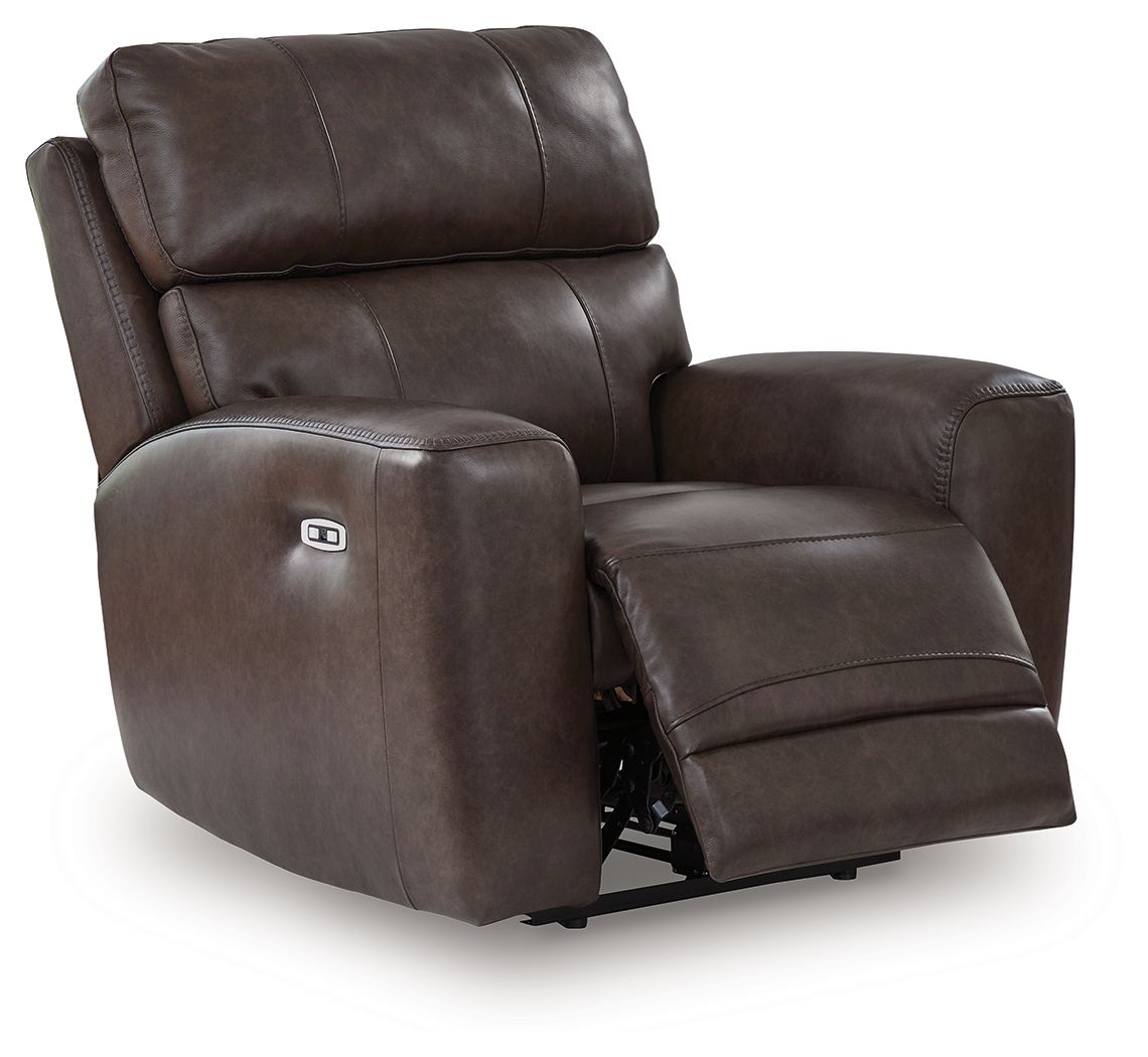 Dark smoke-brown power recliner chair with padded headrest and side control button