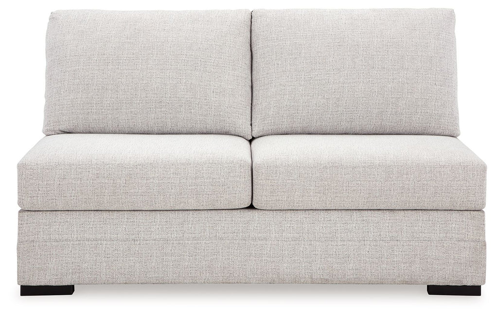 Light gray armless loveseat with wide back cushions and boxed seat design