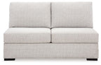 Light gray armless loveseat with wide back cushions and boxed seat design