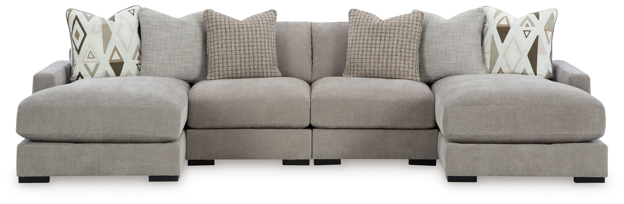 Gray sectional sofa with three ottoman-style seats and decorative patterned throw pillows