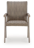 Beige woven arm chair with light wood armrests and woven seat