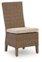 Woven side chair with beige seat cushion and dark wooden legs