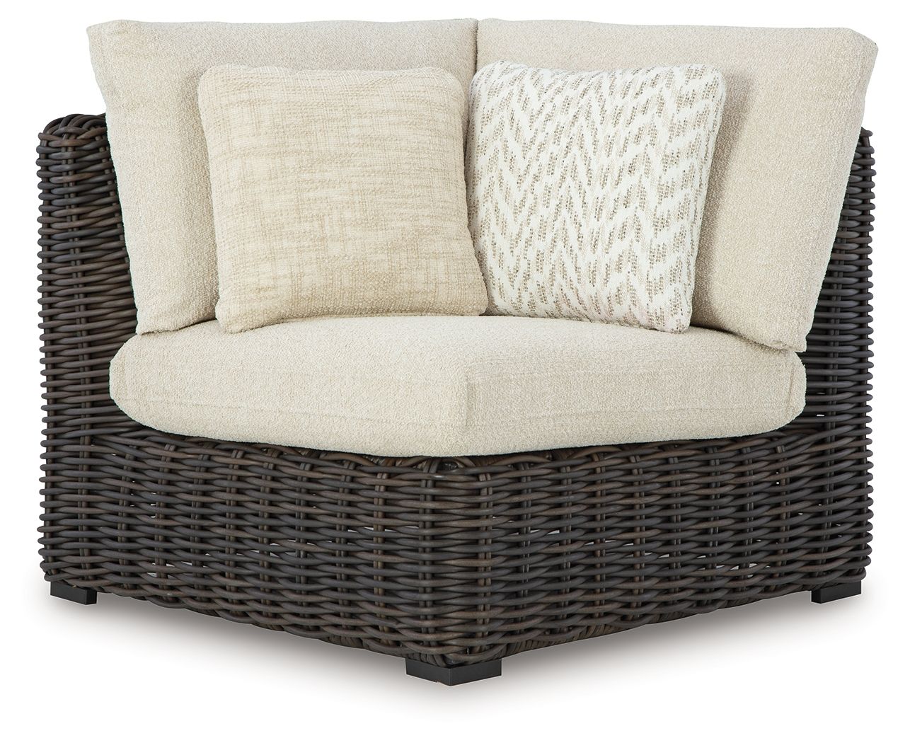 Corner sofa chair with beige cushions and dark wicker frame