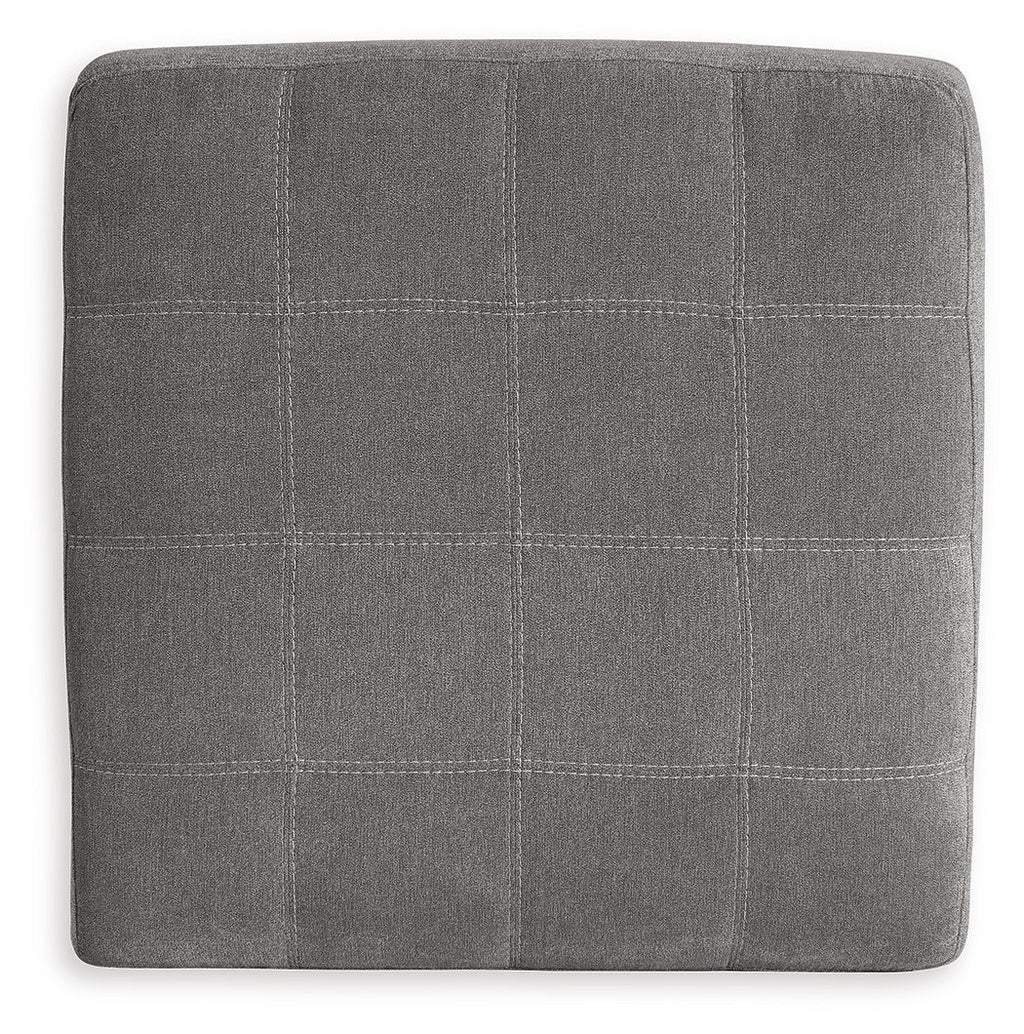 Square upholstered ottoman in gray with stitched grid pattern upholstery