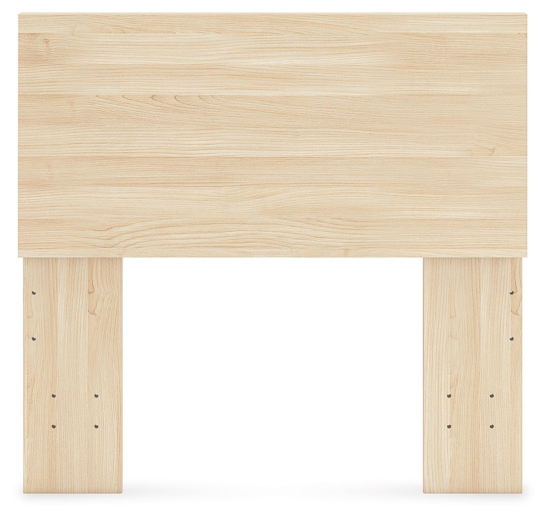 Light wood panel headboard with wide top panel and drilled side posts.