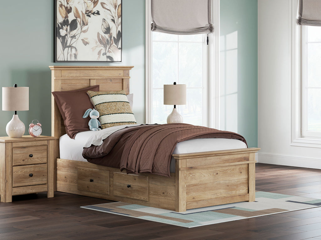 Light brown panel storage bed with two front drawers and layered bedding