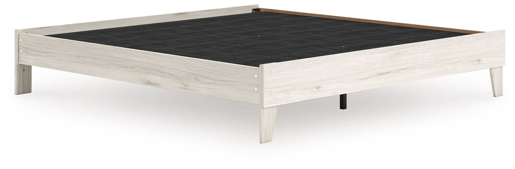 Light beige platform bed frame with black slat base and open center deck