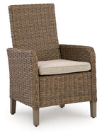Beige armchair with woven wicker texture and light seat cushion, block wooden legs