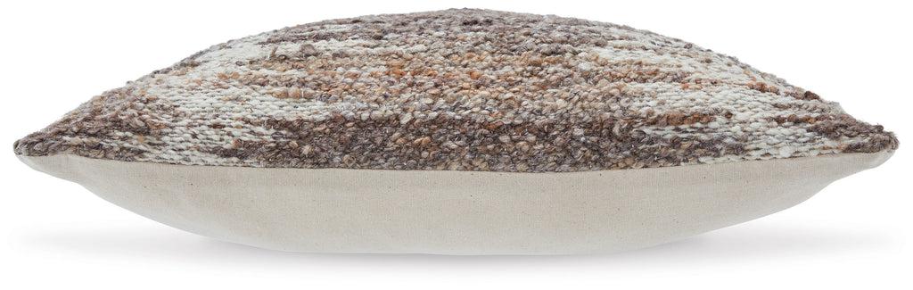 Decorative speckled pillow in dark brown and beige, angled side view