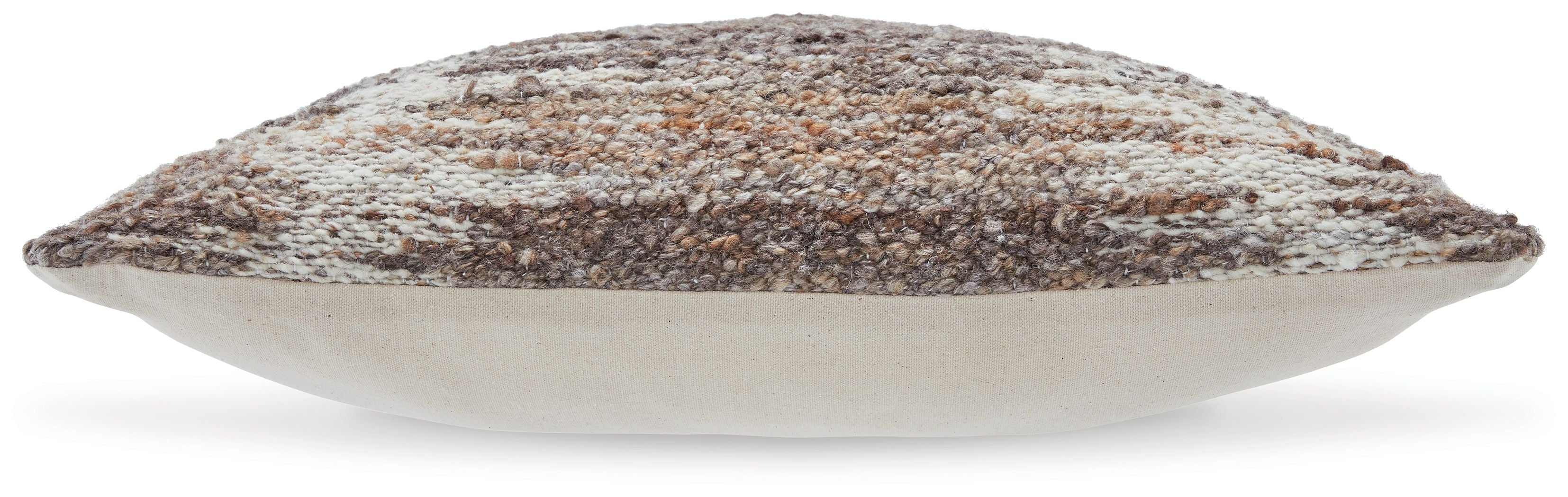 Decorative speckled pillow in dark brown and beige, angled side view