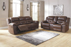 Dark brown reclining sofa and loveseat with padded armrests and tufted cushions