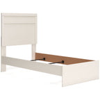 Light wood panel bed with tall headboard; open base shows storage platform