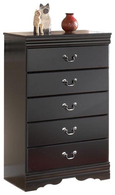 Black five-drawer chest with metal knob pulls and scalloped base.