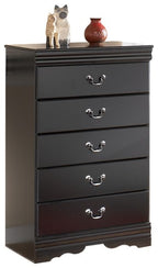 Black five-drawer chest with metal knob pulls and scalloped base.