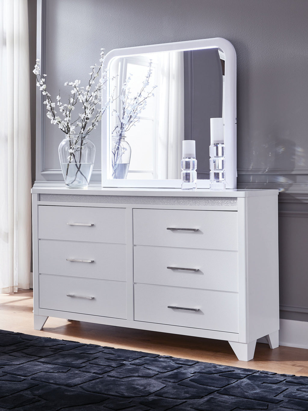 White dresser with arched mirror and six drawers, silver bar pulls
