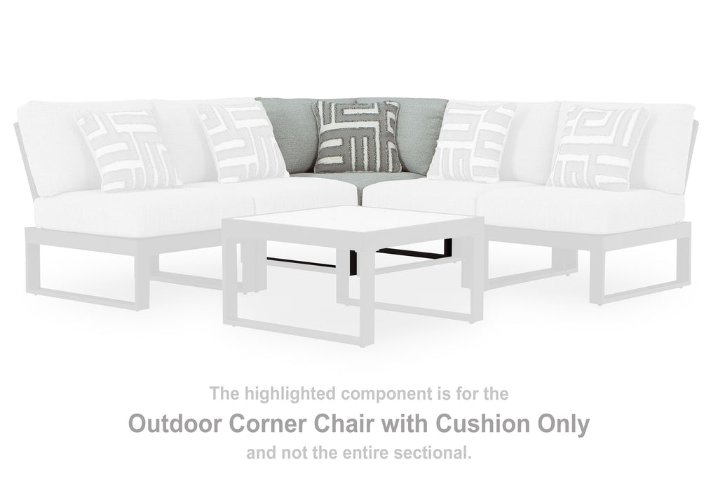 White outdoor corner chair with seat cushion and patterned throw pillows
