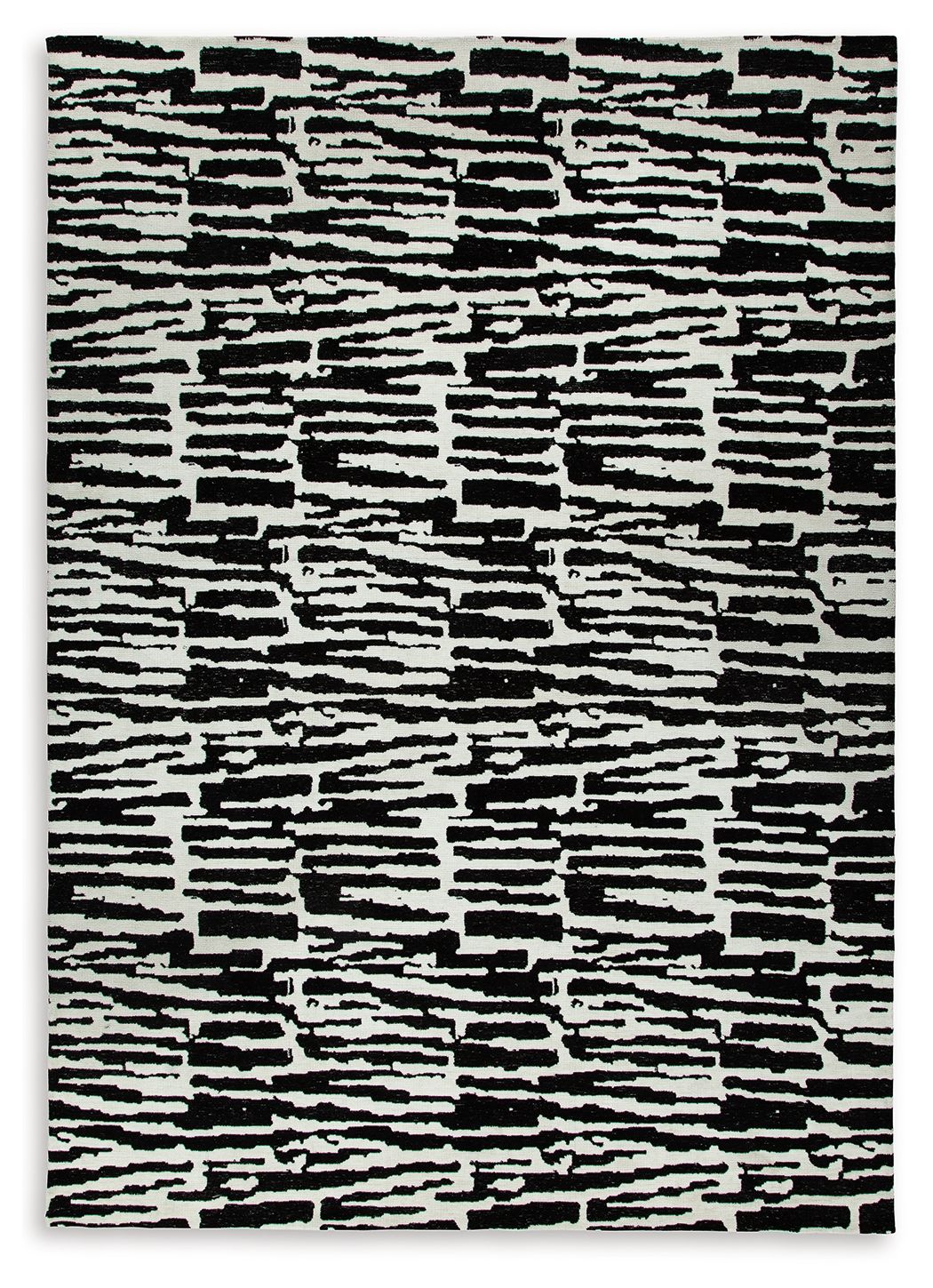 Black-and-white abstract striped area rug with irregular blocks and high-contrast lines
