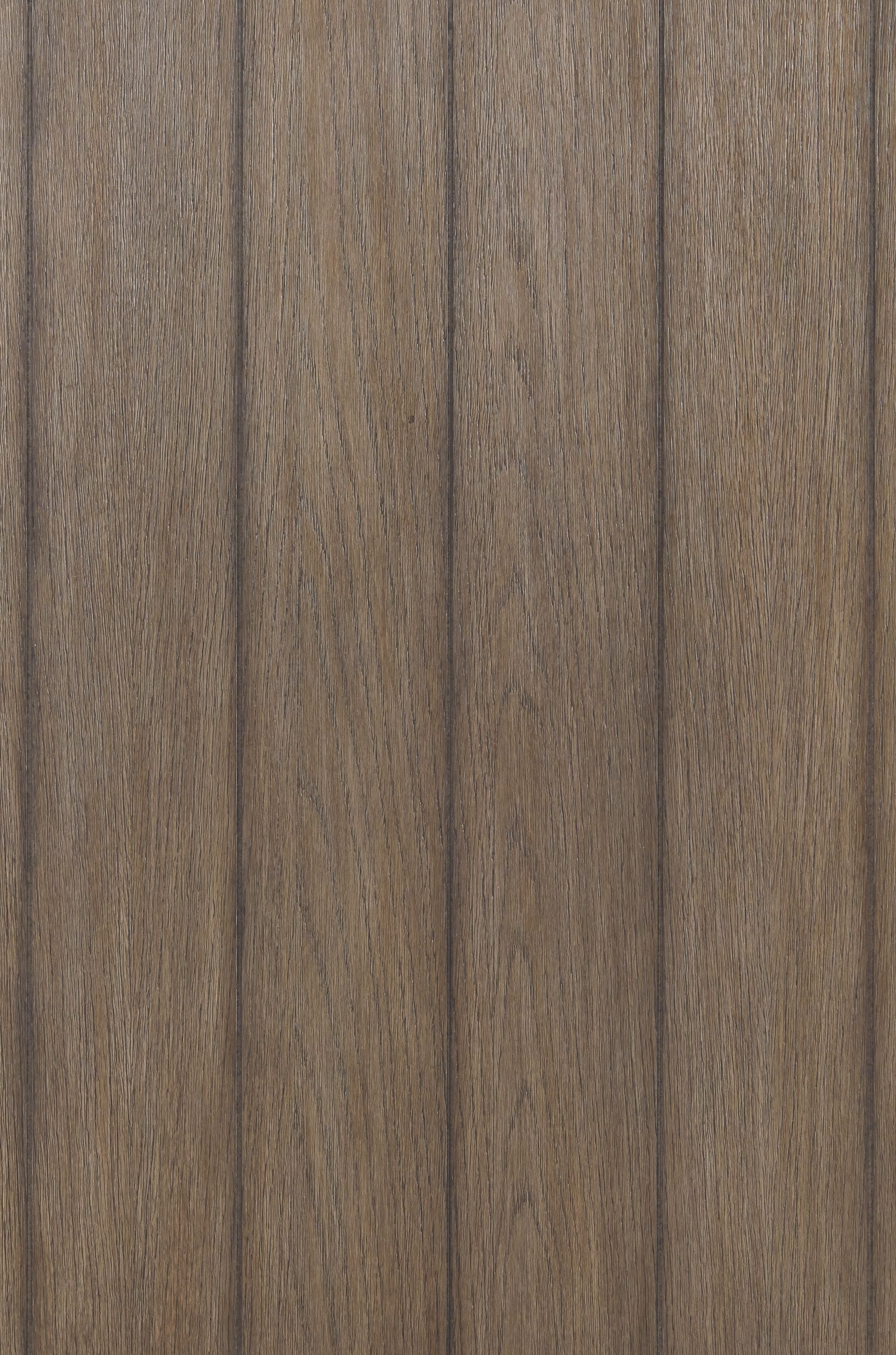 Wood tabletop close-up with vertical grain, medium brown finish