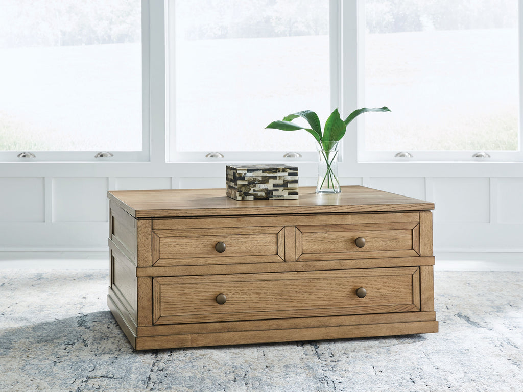 Light brown lift-top cocktail table with two drawers and round metal handles