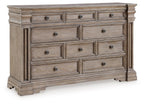 Gray wood dresser with multiple drawers and panel molding, dark round knobs