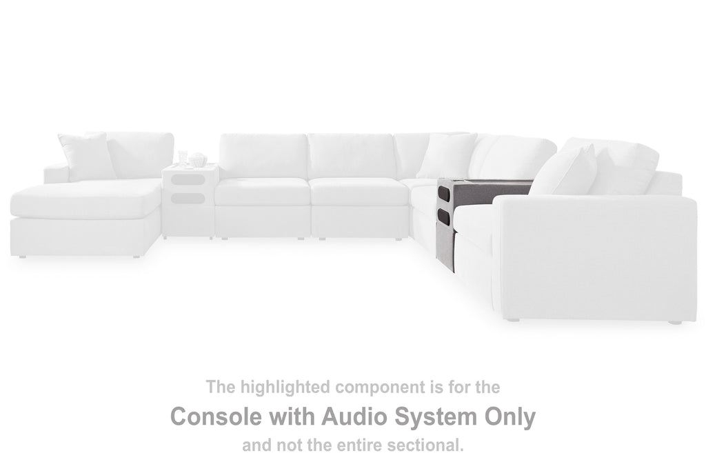 White sectional seating with highlighted console with audio system component