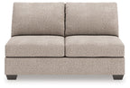 Beige armless full sleeper loveseat with two seat cushions and two back cushions