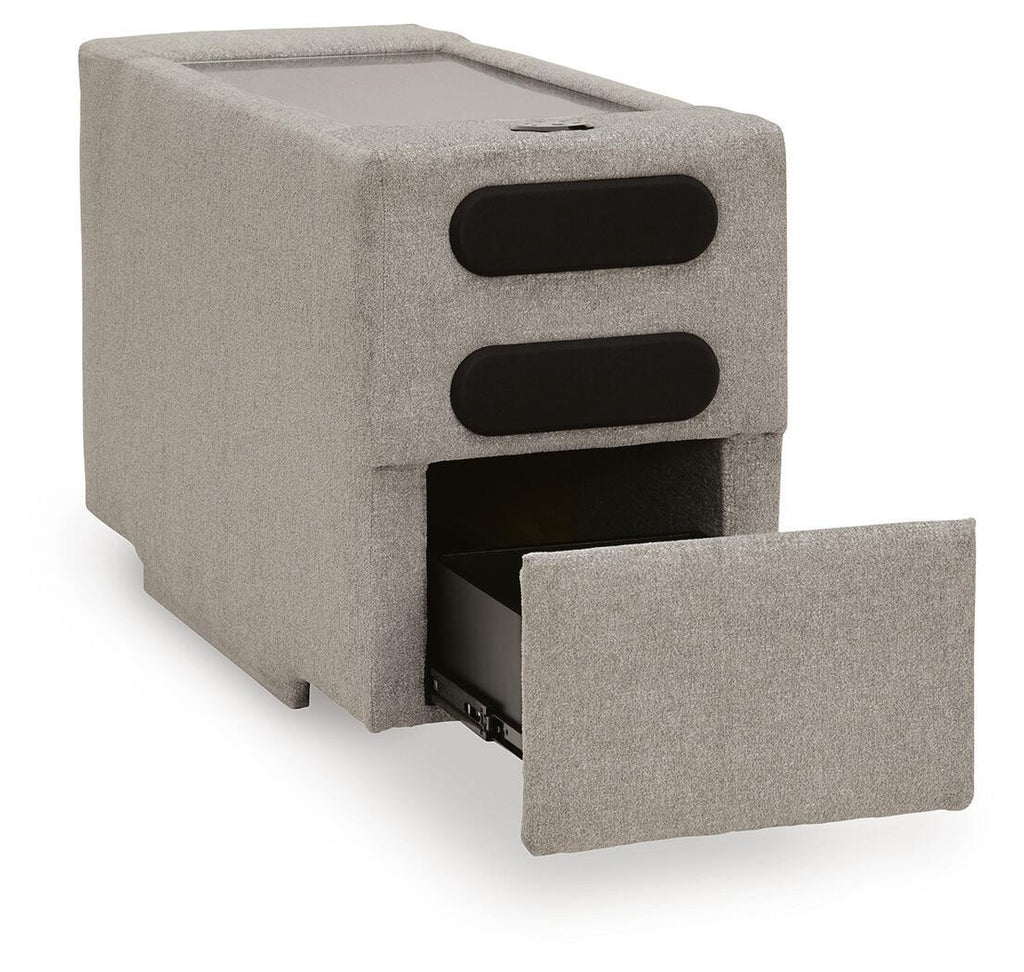Flint gray upholstered console with audio system, two black speaker grilles and open bay