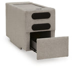 Flint gray upholstered console with audio system, two black speaker grilles and open bay