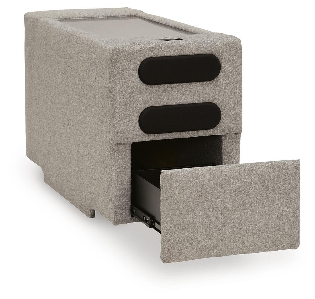 Flint gray upholstered console with audio system, two black speaker grilles and open bay
