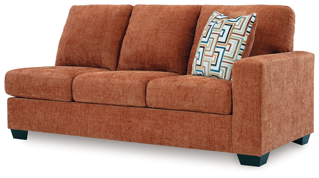 Rust orange RAF sofa side view with armrest and patterned cushion
