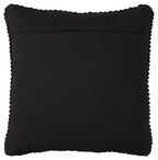 Black square throw pillow with smooth fabric and scalloped edge trim.