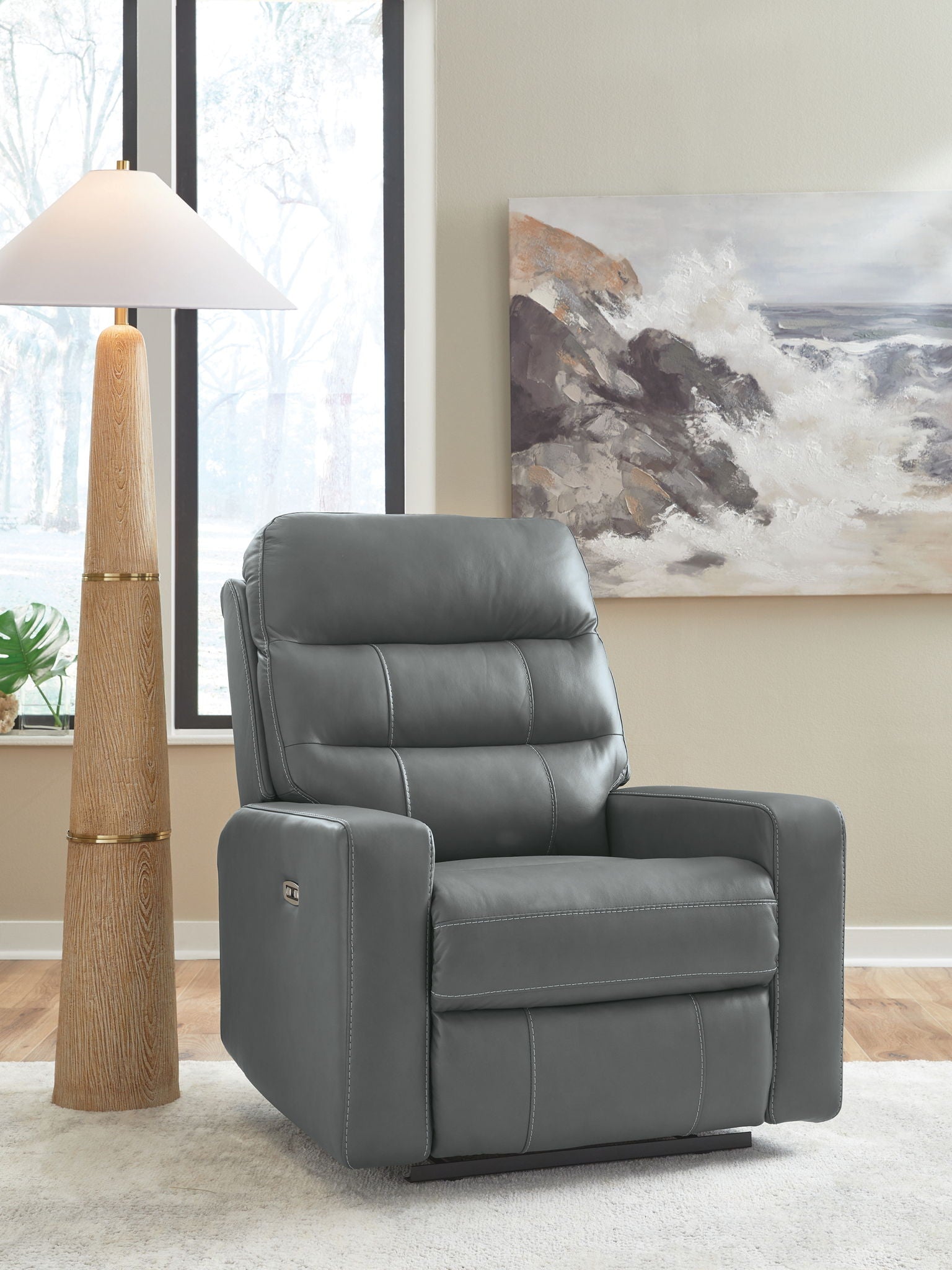 Power recliner with adjustable headrest in gray leather-look upholstery, padded arms