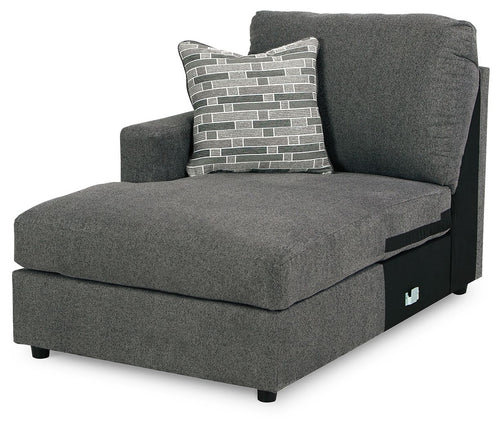 Corner chaise in dark gray fabric with two accent pillows and padded arm
