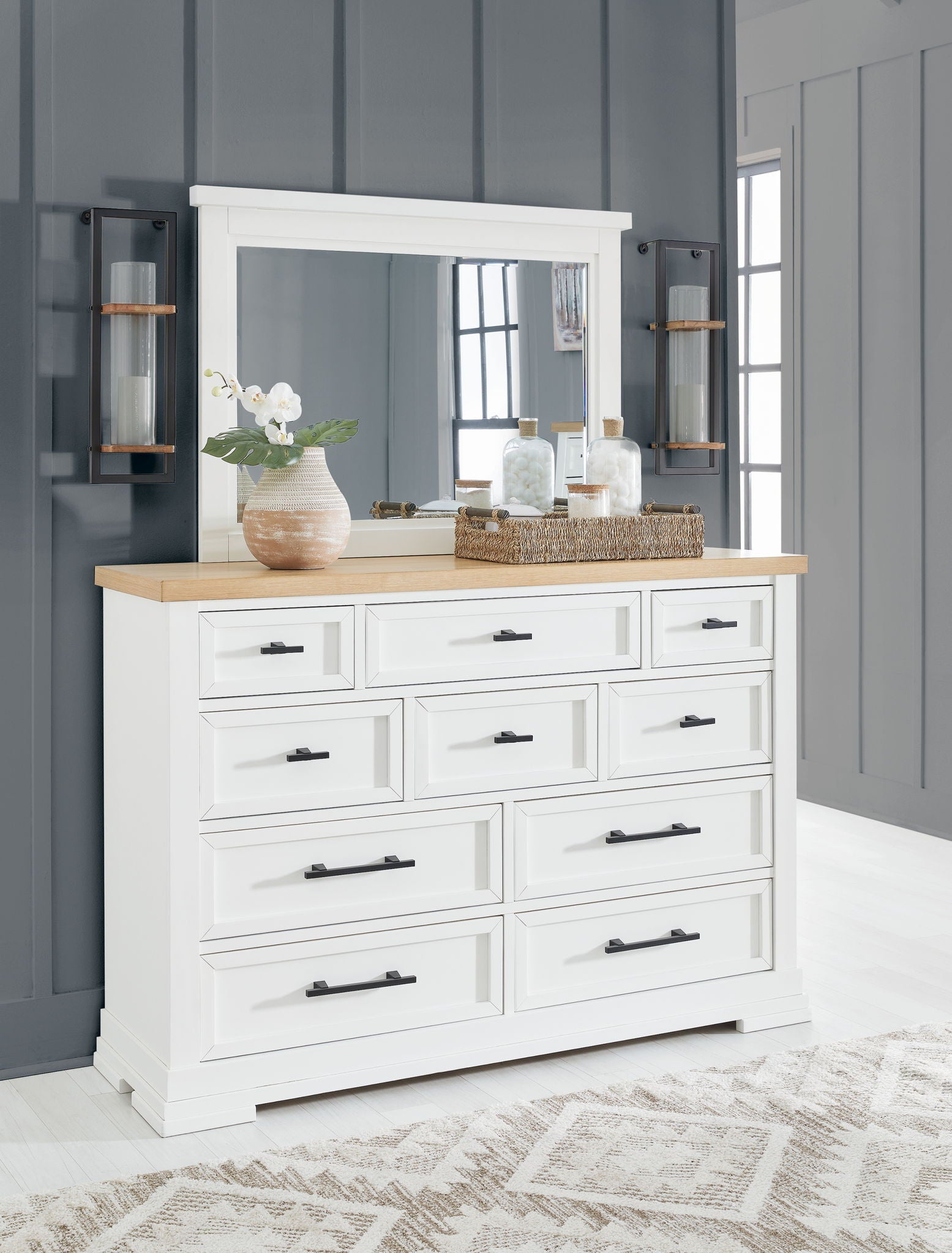 White panel storage dresser with eight drawers and dark wood countertop