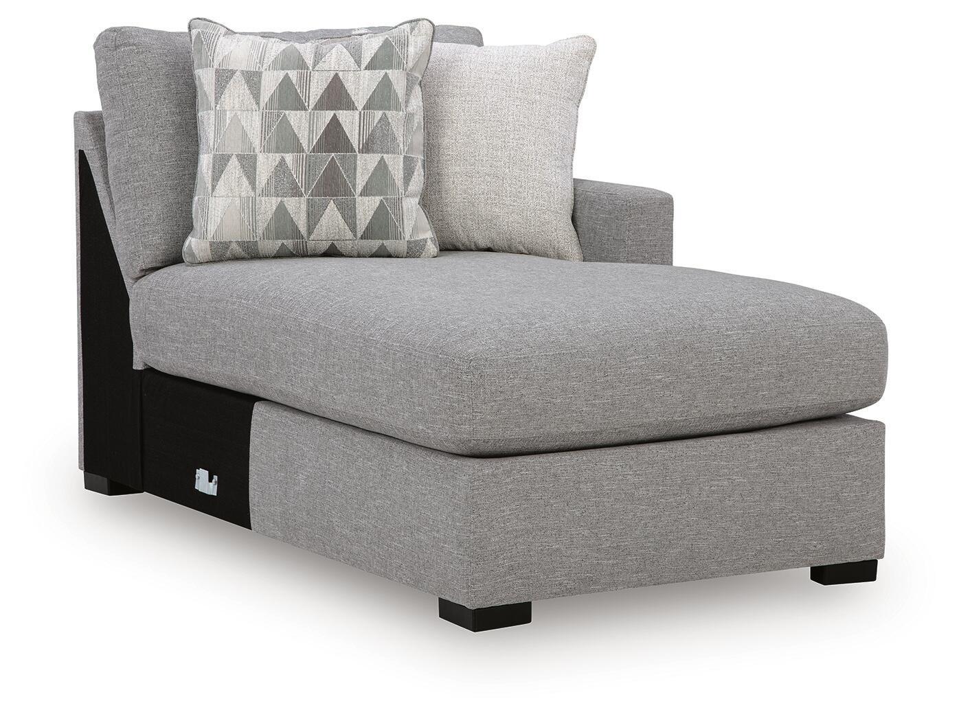 Pewter gray corner chaise with armrest, dark feet, and patterned throw pillow