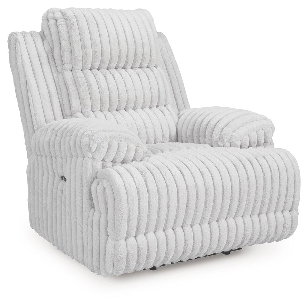 Light gray zero wall recliner with vertical channel tufting and padded armrests