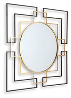 Round black accent wall mirror with gold rim and stacked square metal accents.