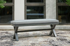 Gray outdoor bench with cushion and angled dark gray supports