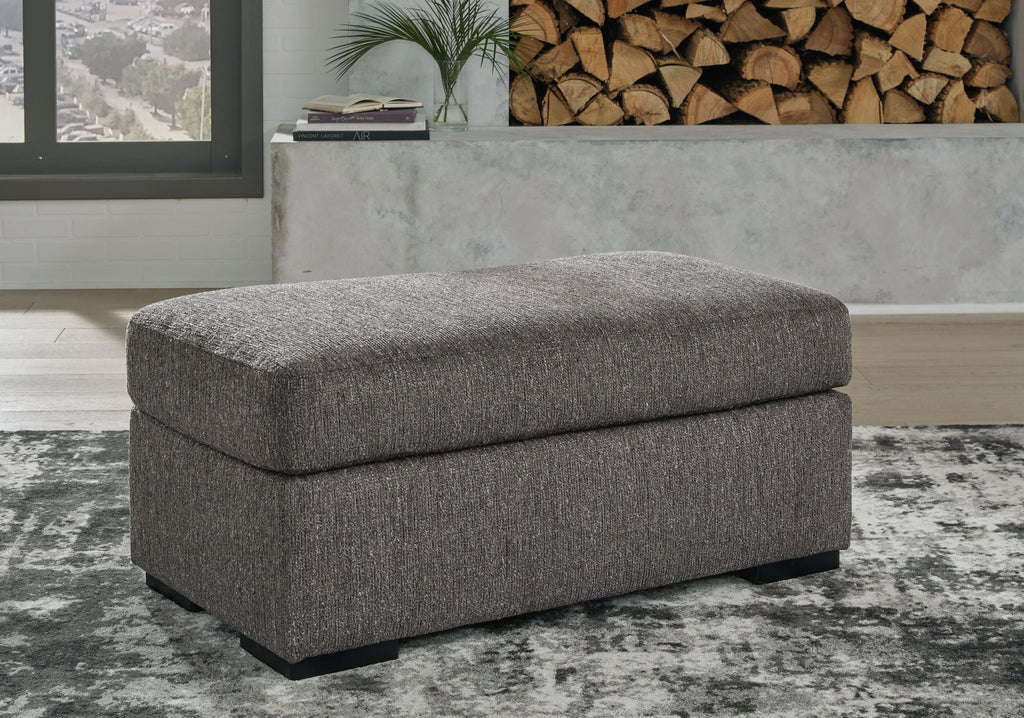 Pewter fabric ottoman footrest with rounded top and low black legs