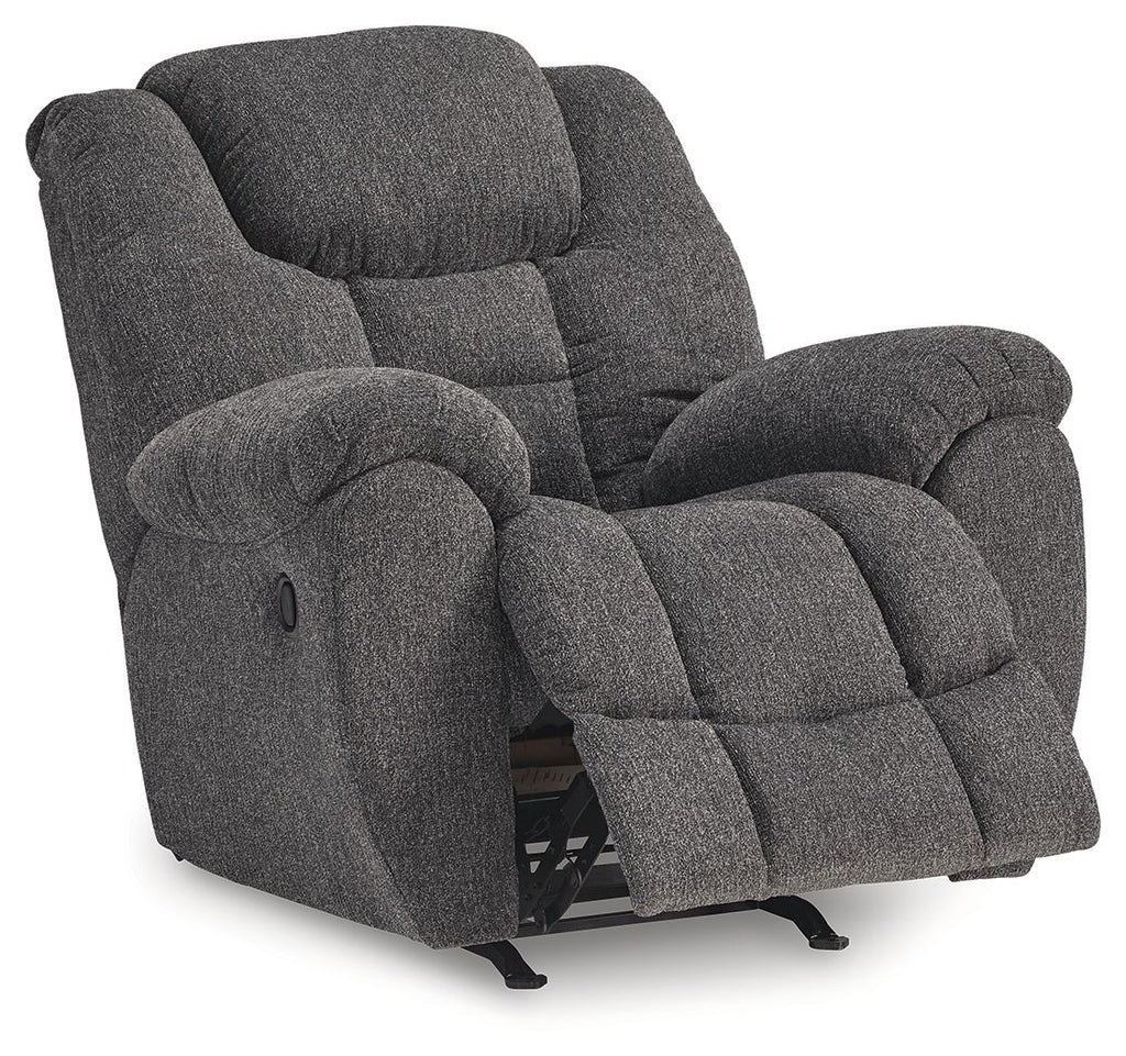 Charcoal fabric rocker recliner with extended footrest and padded armrests, side view