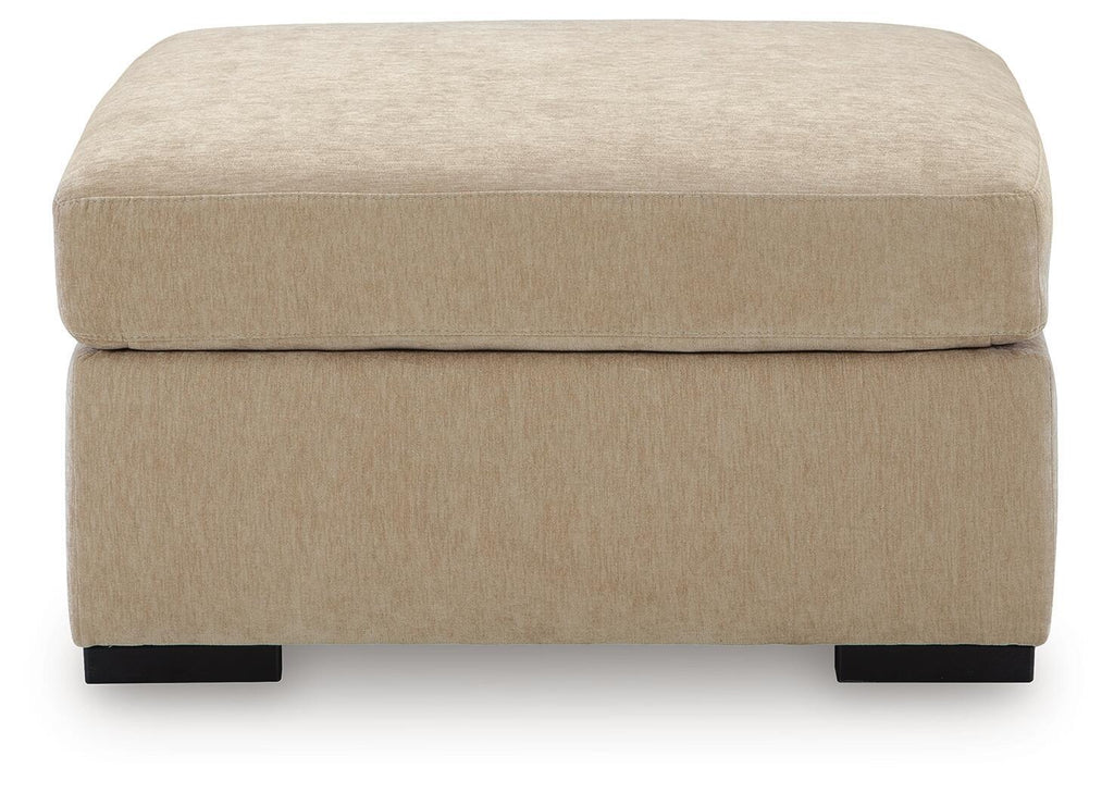 Light brown upholstered oversized accent ottoman front view with black feet