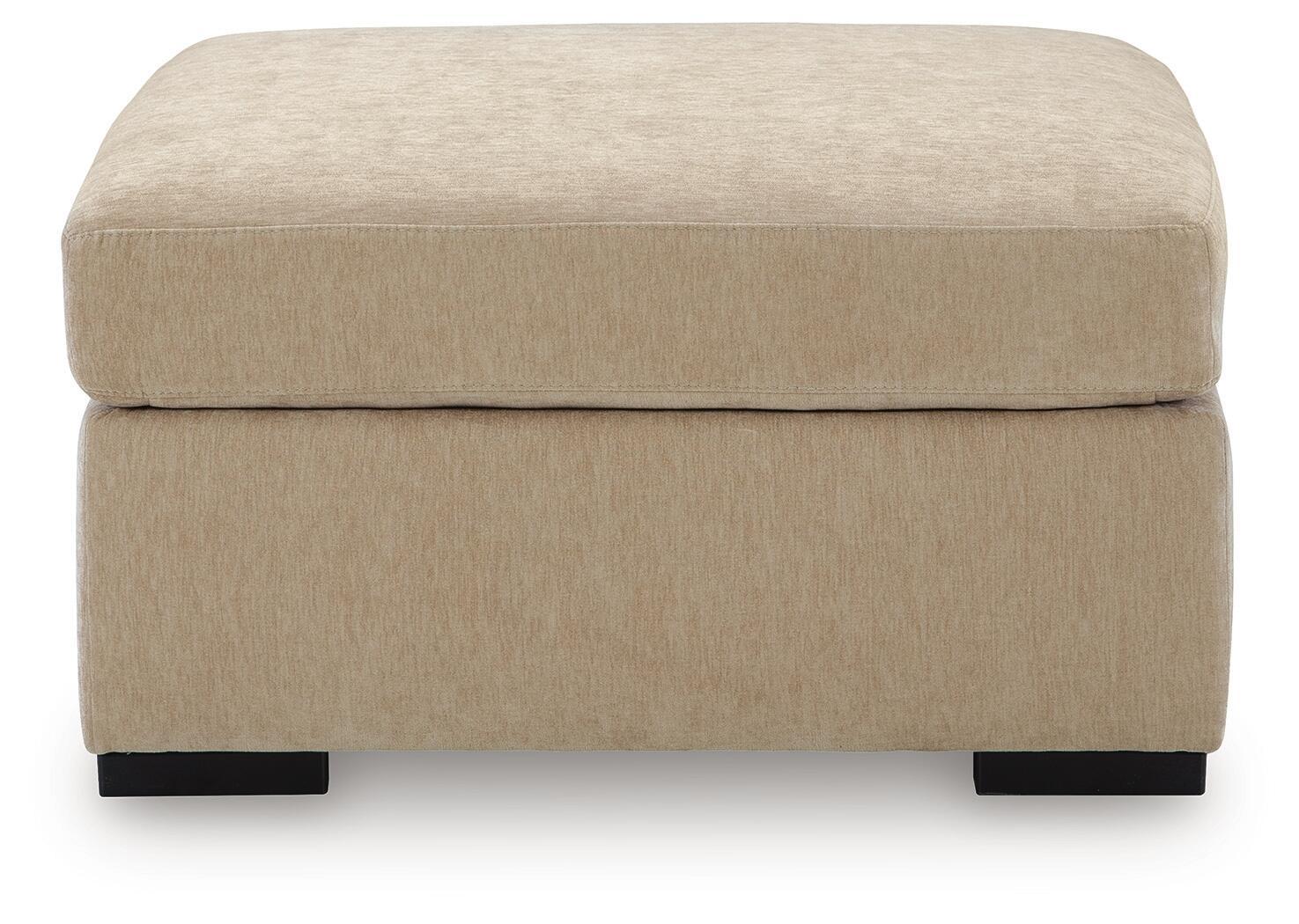 Light brown upholstered oversized accent ottoman front view with black feet