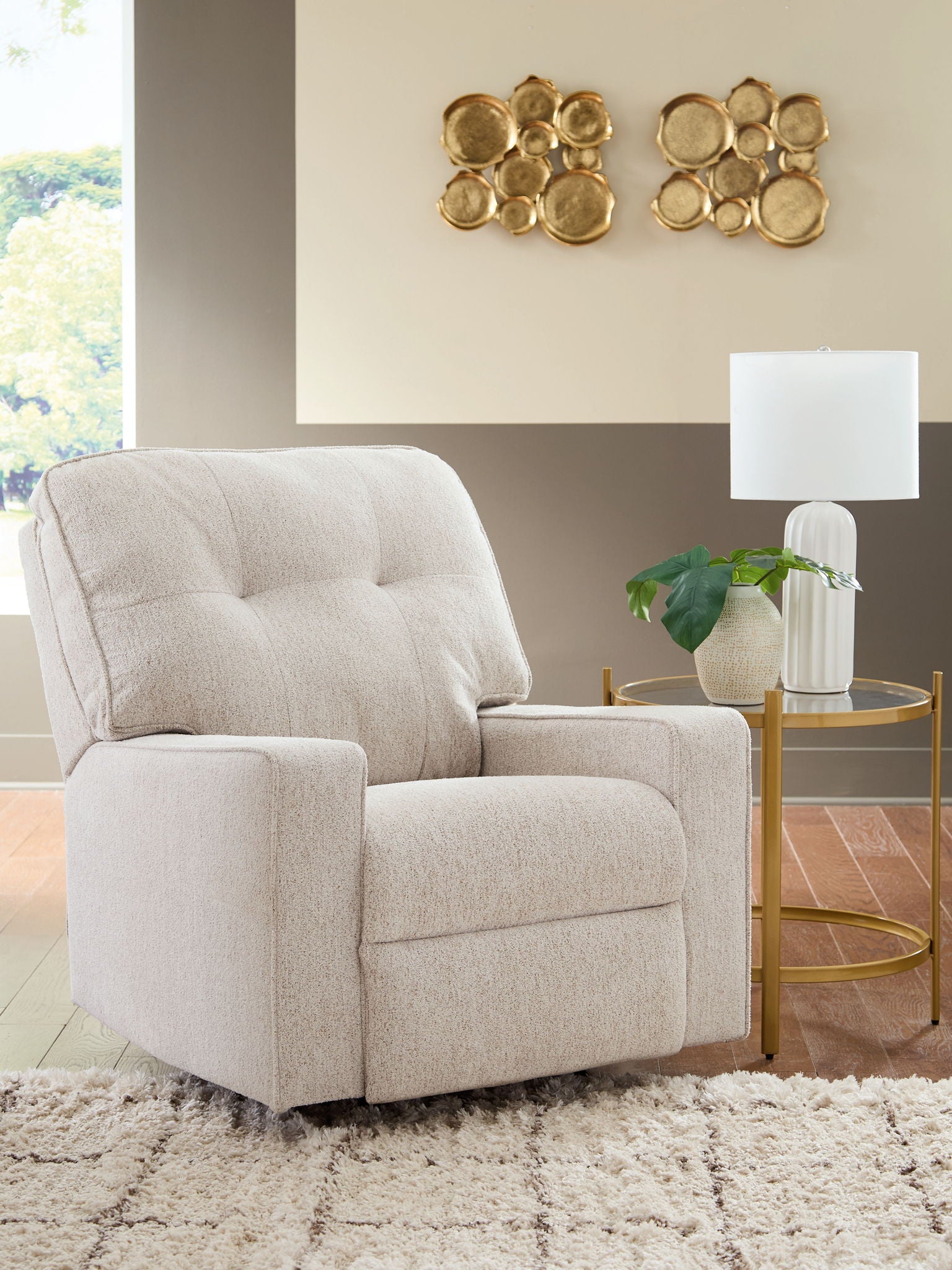 Stone fabric rocker recliner with tufted back and arms, angled view