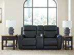 Black power reclining loveseat with console and adjustable headrest, centered front