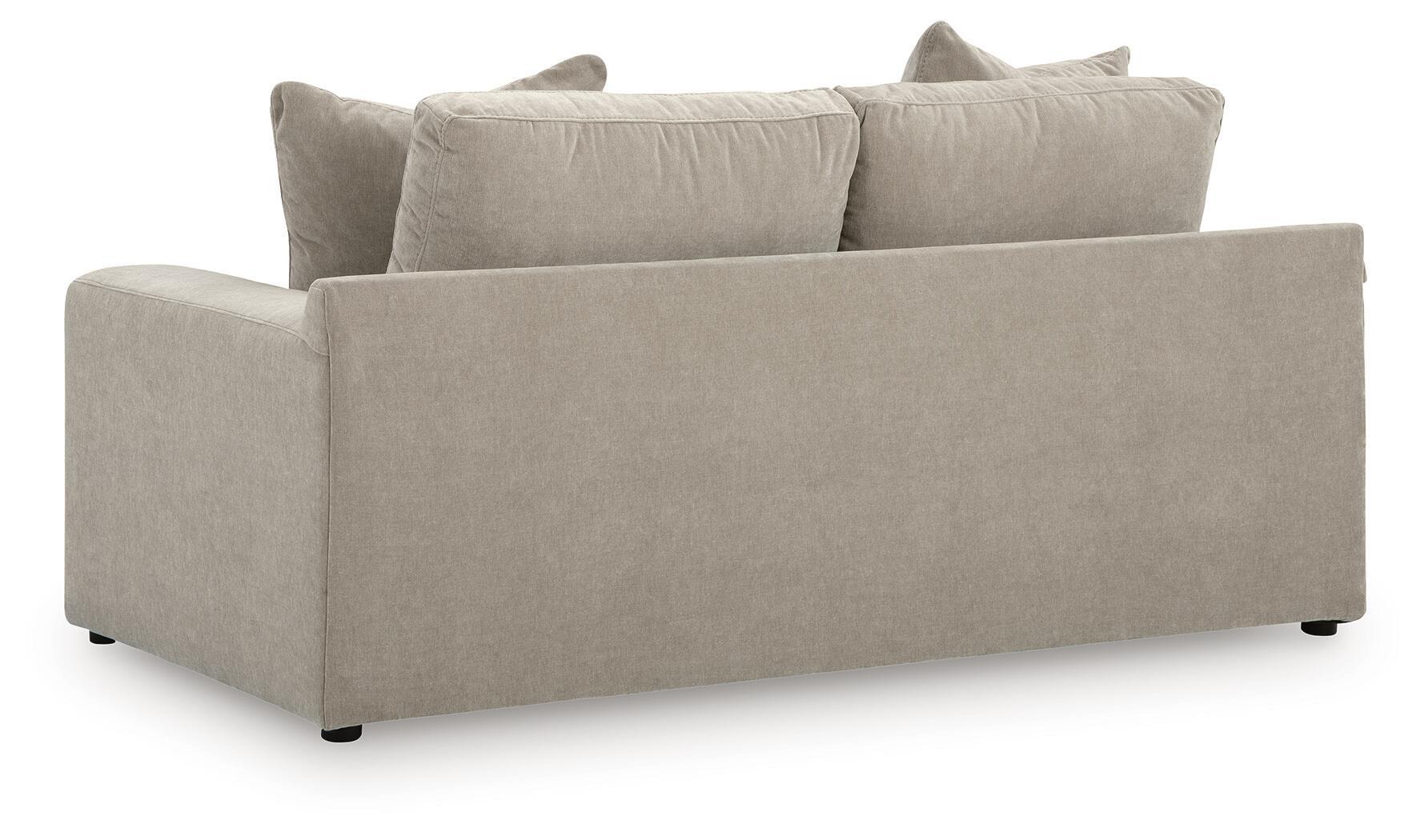 Light gray loveseat with two seat cushions and four back pillows, wide arms