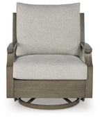 Swivel glider chair with cushion, light beige seat and back with dark brown arms