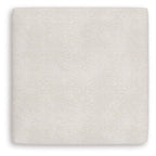 Vanilla upholstered ottoman seat in textured fabric, square shape