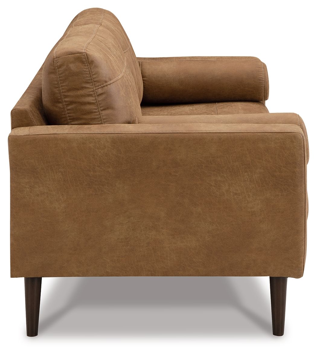 Light brown upholstered armchair side view with tall padded back and rounded arms