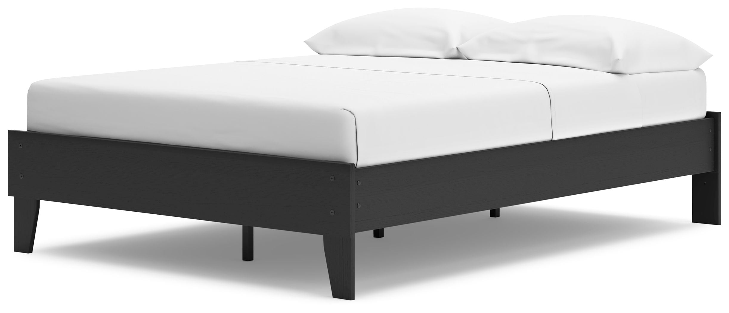 White platform bed mattress with black side rails and short legs